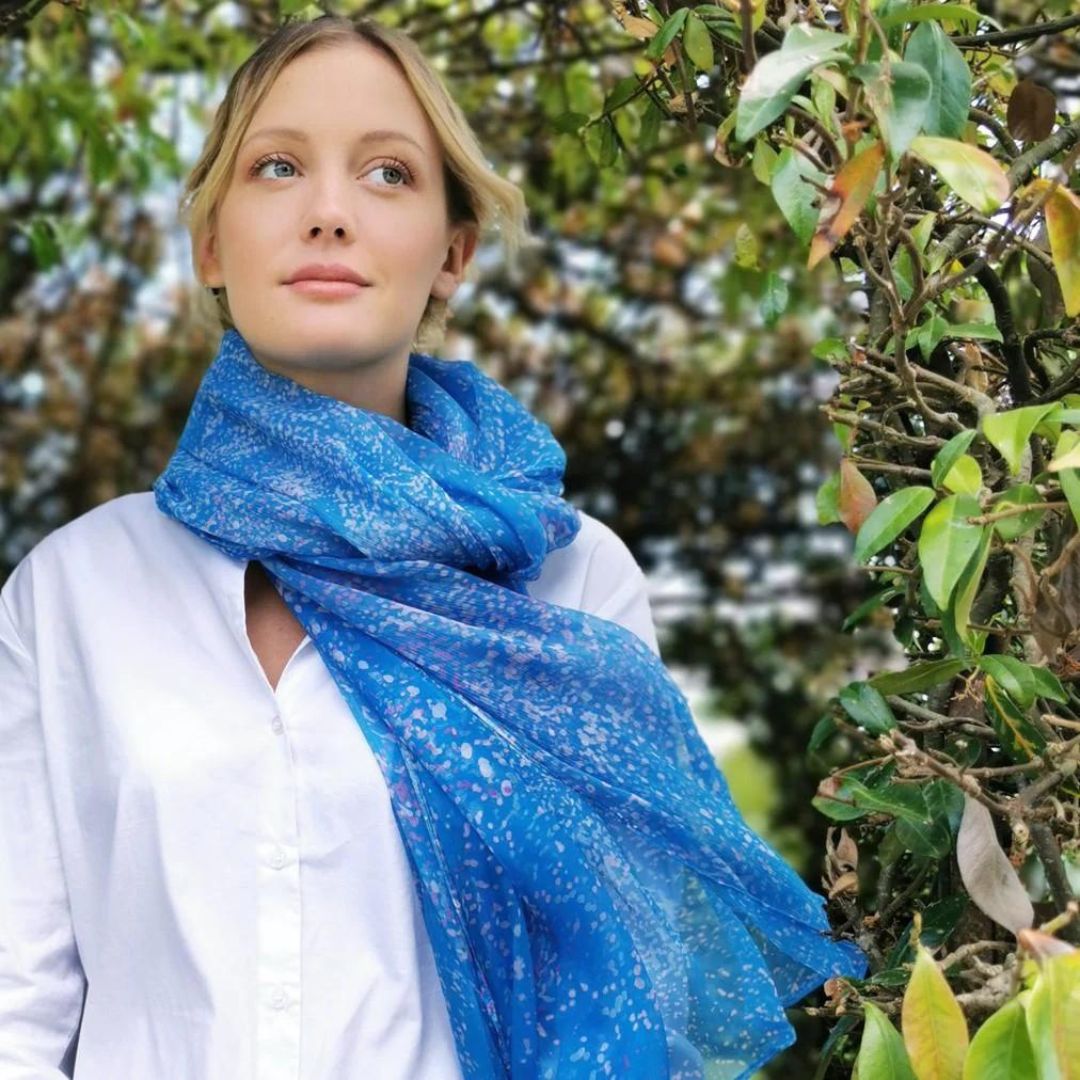 Woman with celia blue scarf from petrusse in nature