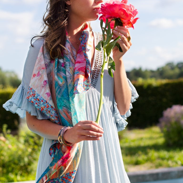 Model with flower and silk scarf