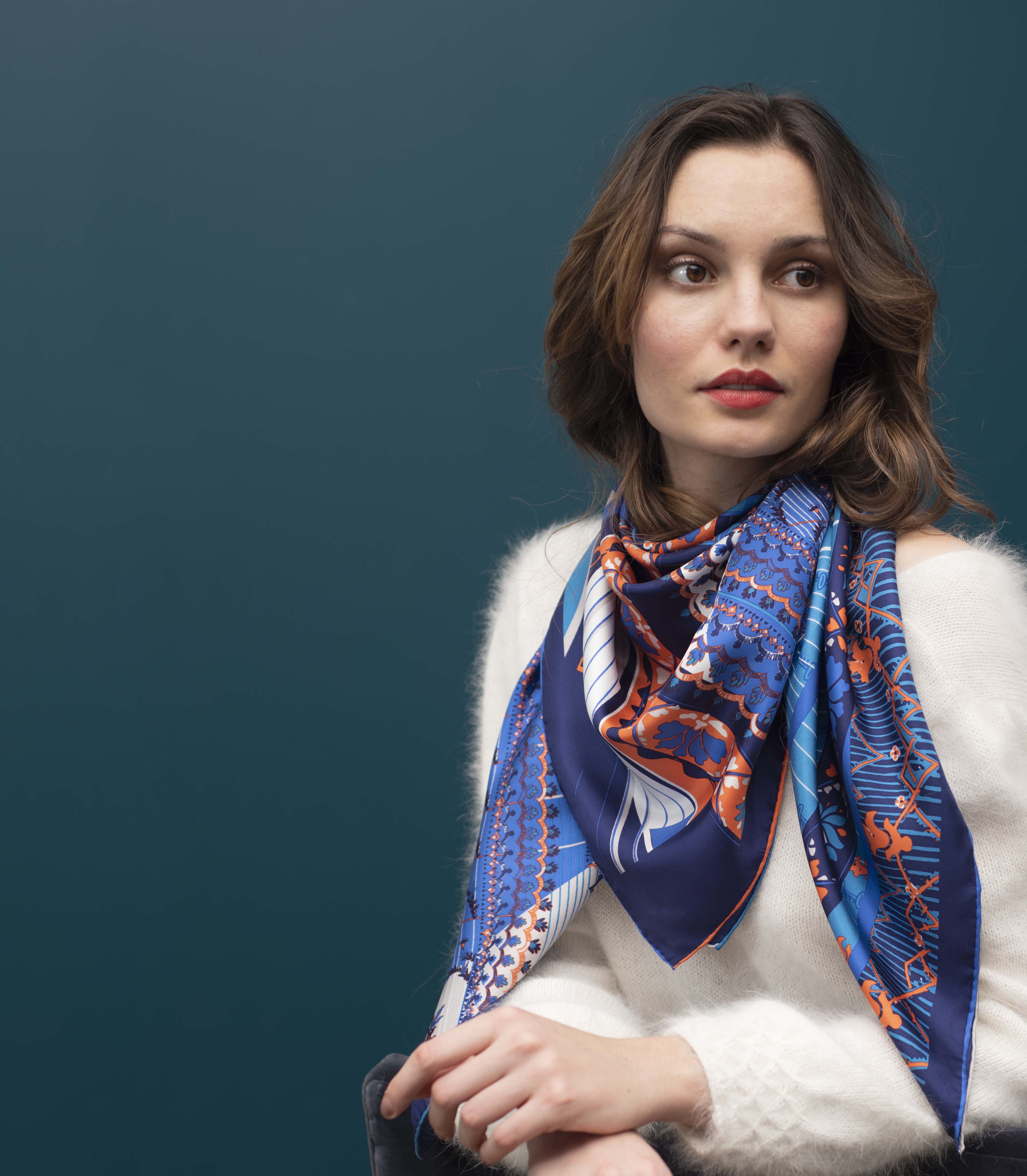 Woman with silk scarf leaning